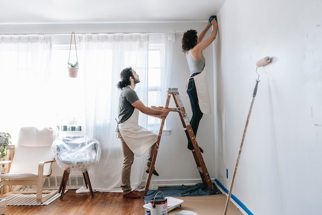 A couple working on home repairs | Spyglass Realty